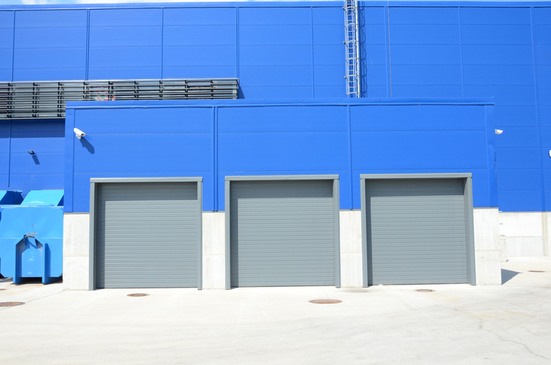 3 grey roller shutter door on factory